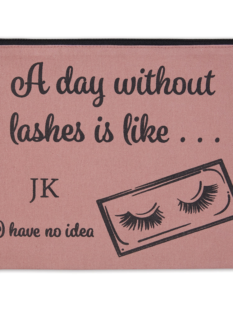 Pink pouch with eyelash design and humorous text on a white background