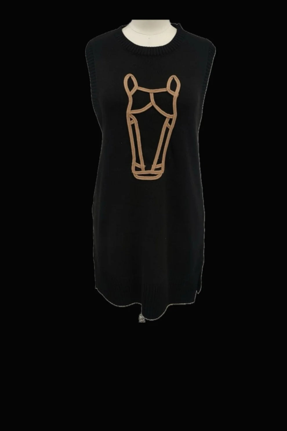 Black sleeveless dress with a beige graphic on a mannequin against a black background