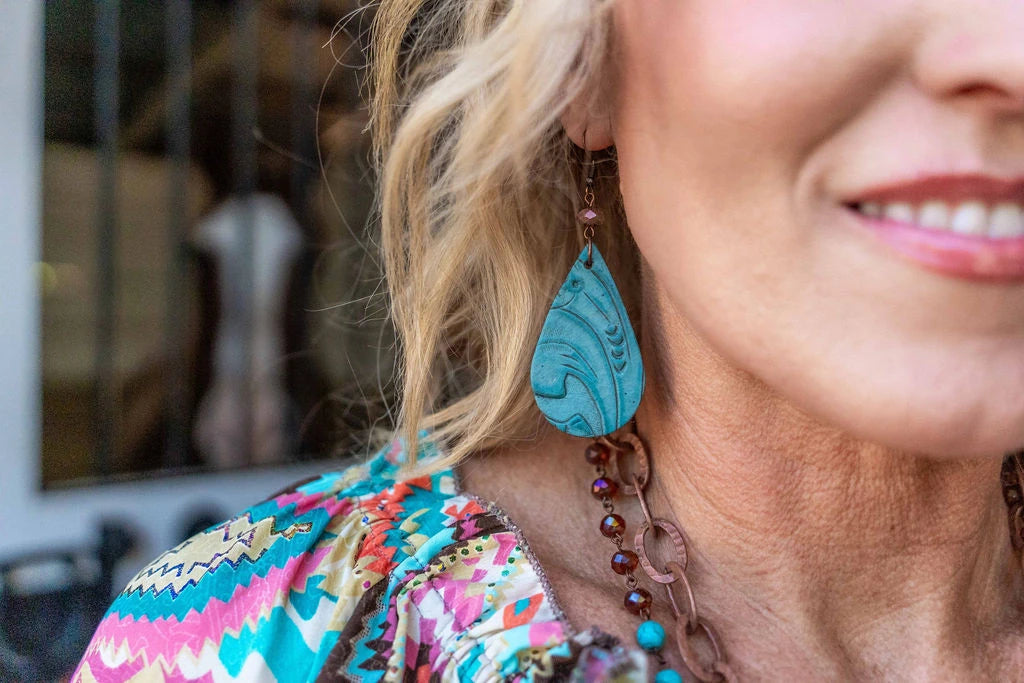 Western-inspired teardrop earrings with intricate embossed leather design