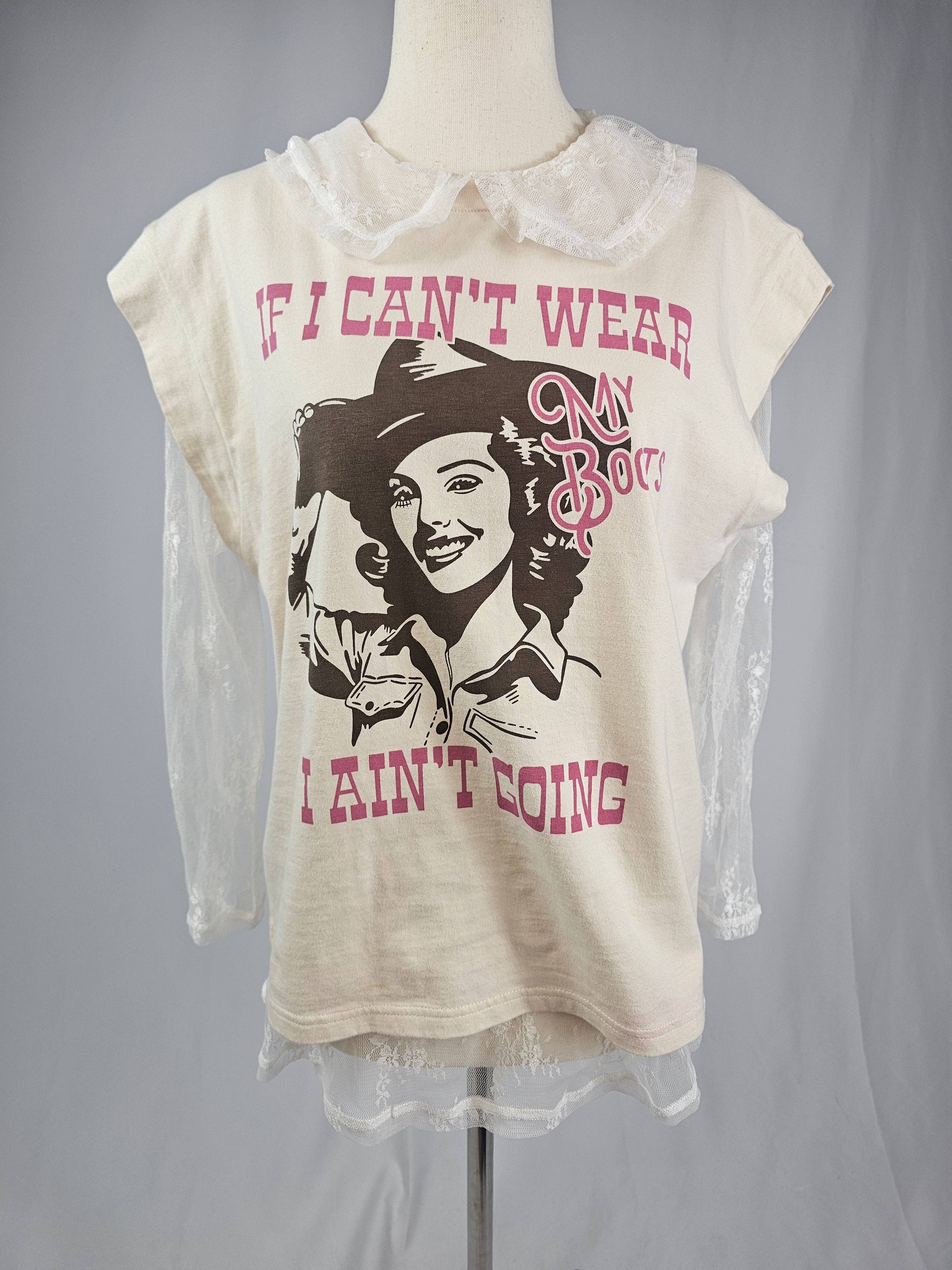 T-shirt with graphic design and text on a mannequin against a gray background