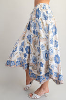 Floral patterned skirt with blue flowers on a plain background