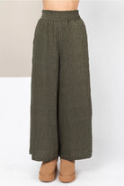 Olive crinkle bodré wide-leg pants with lettuce-edge elastic waist—front view