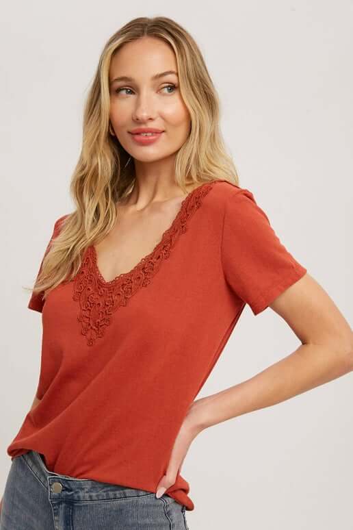 V neck rust short sleeve tee with crochet accents around v neck