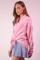 Side view pink cotton gauze shirt highlighting side slit and curved hem