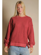 Front view of burgundy oversized waffle knit top with round neck and drop shoulders.