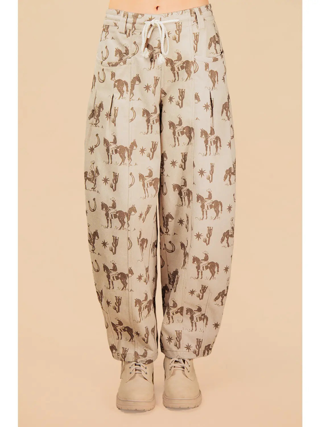 Light-colored pants with horse pattern on a beige background