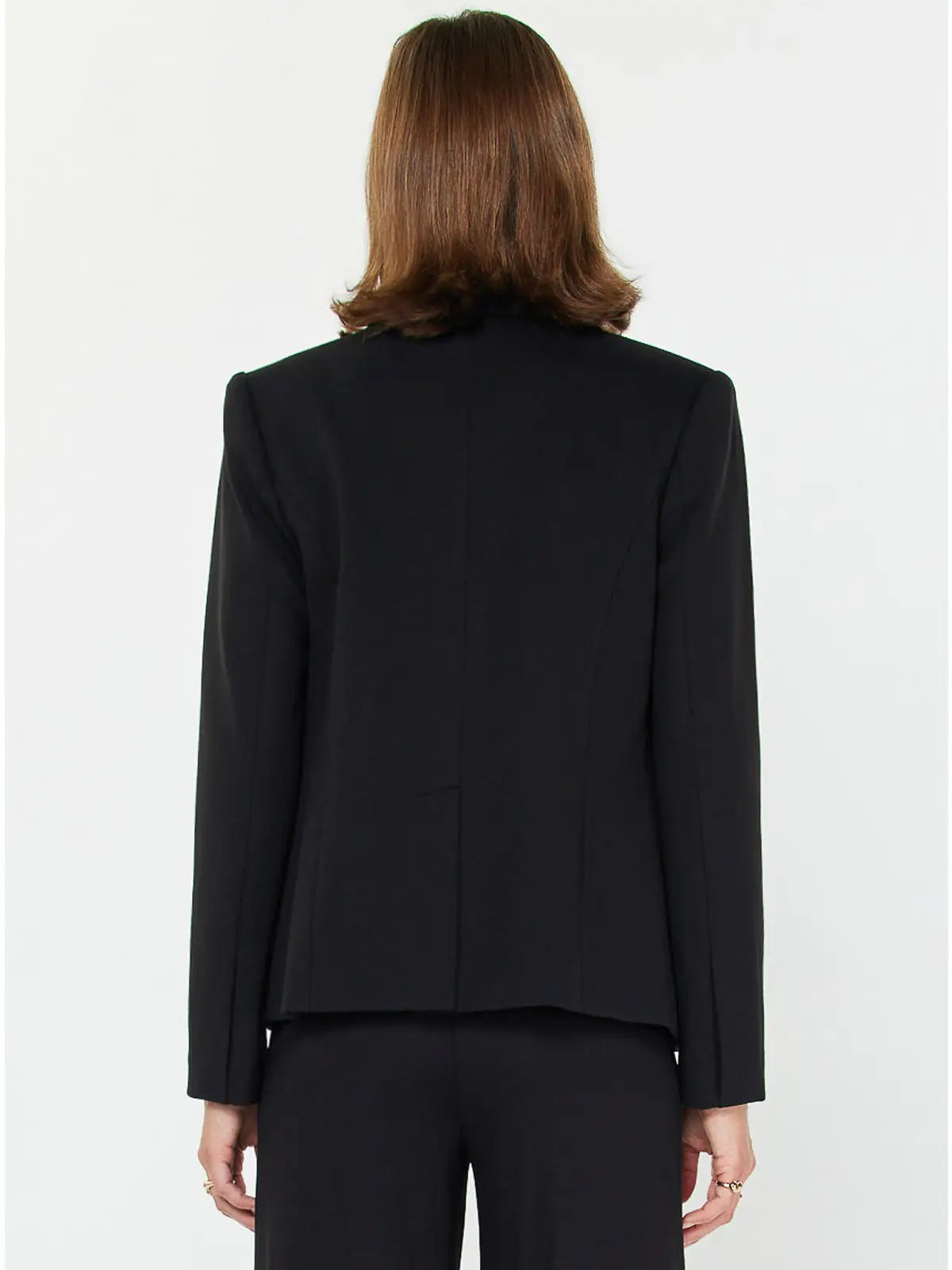 Back of Person wearing a black  blazer on a white background