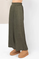 Side view of high-waisted wide leg in textured fabric