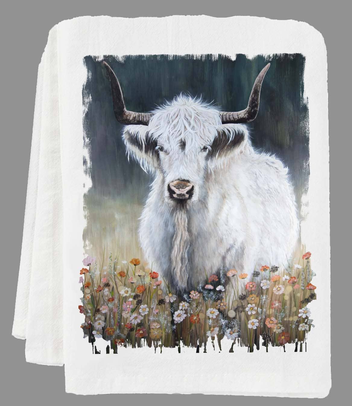 Folded kitchen towel with a highland cow design on a gray background