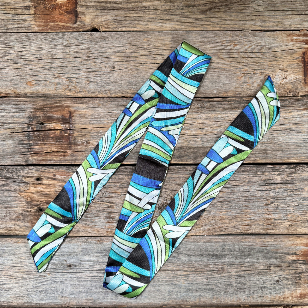 Patterned thin scarf on a wooden surface