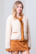 Front view of taupe Western sherpa jacket with zig-zag faux-suede trim on model