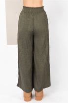 Back view showing pull-on waistband and in-seam pockets”