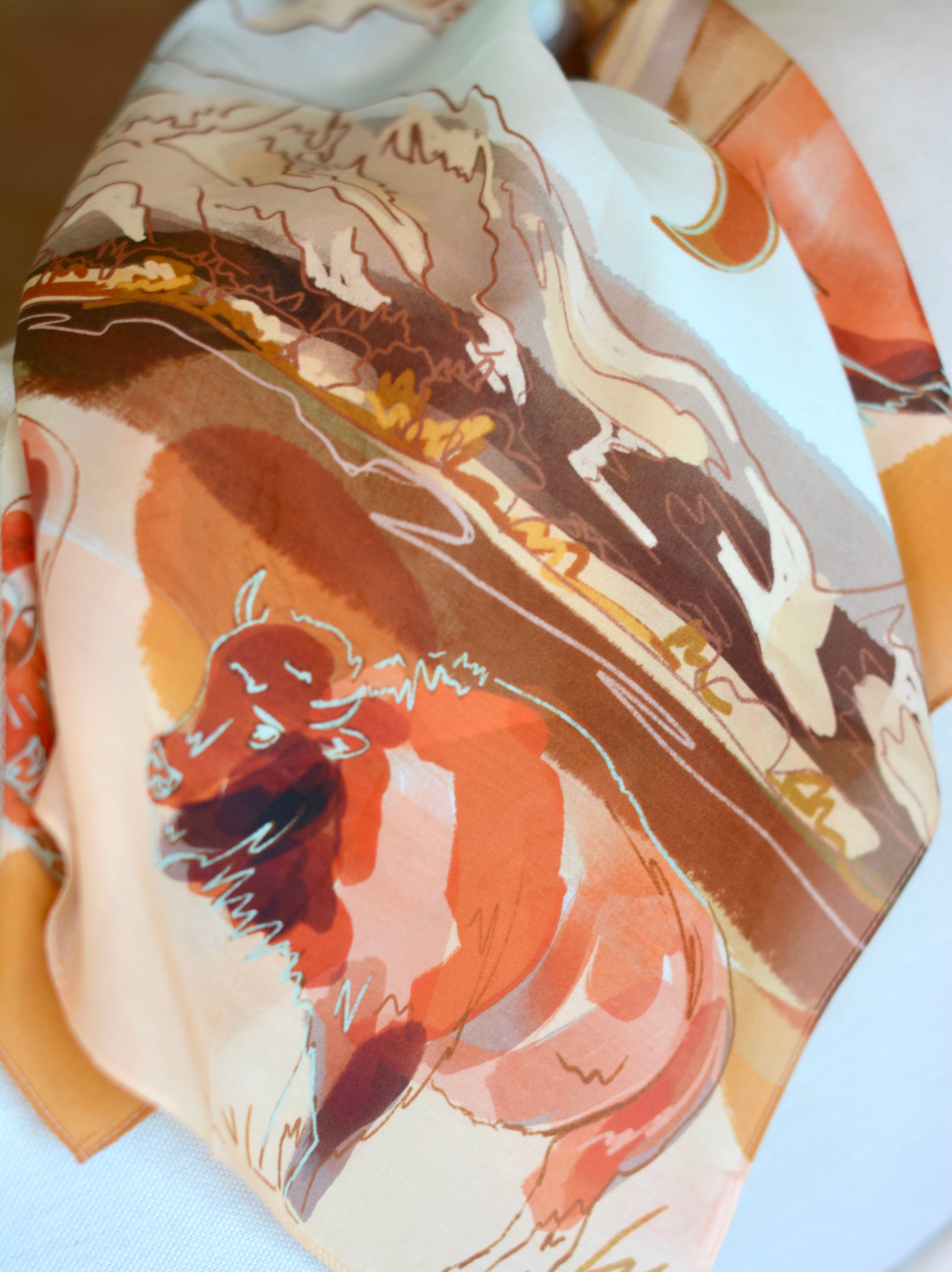 Close-up of a fabric with abstract art design featuring animals on a white background