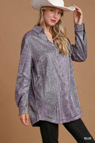 Woman wearing a patterned shirt and cowboy hat against a brown background