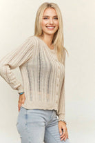 Lightweight cream open-knit cardigan featuring a button-front closure, crew neckline, vertical ribbed crochet detailing, and long sleeves for effortless layering.