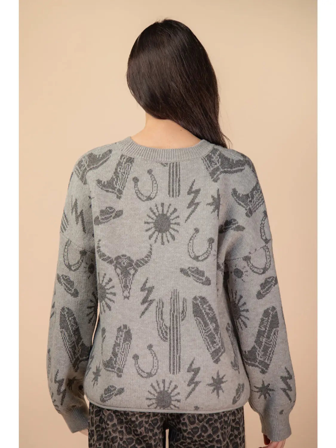 Back view of grey oversized knit sweater with rib hem and cuffs