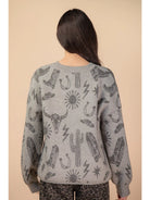 Back view of grey oversized knit sweater with rib hem and cuffs