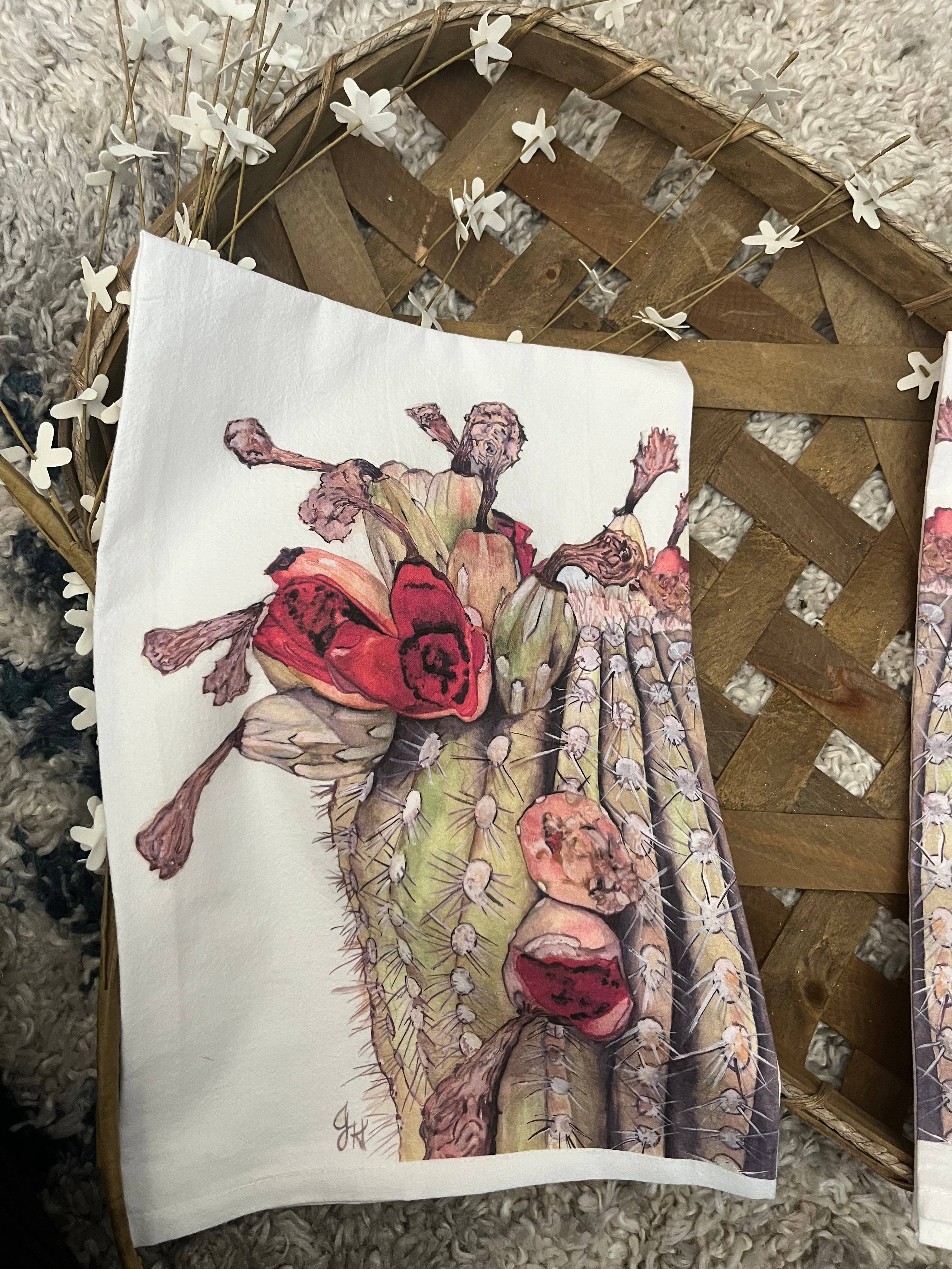 Towel with a cactus and flower design on a textured surface