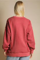 Back view of oversized waffle top with long sleeves and curved hem