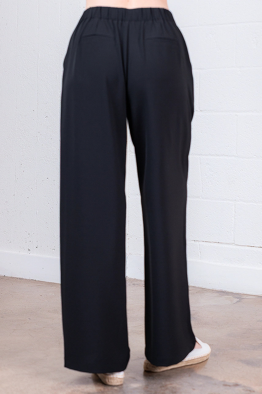 Black wide-leg pants on a neutral background
