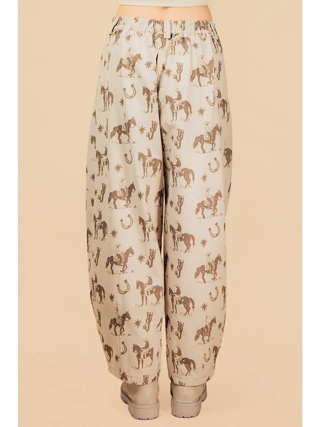 Beige pants with horse pattern on a beige background