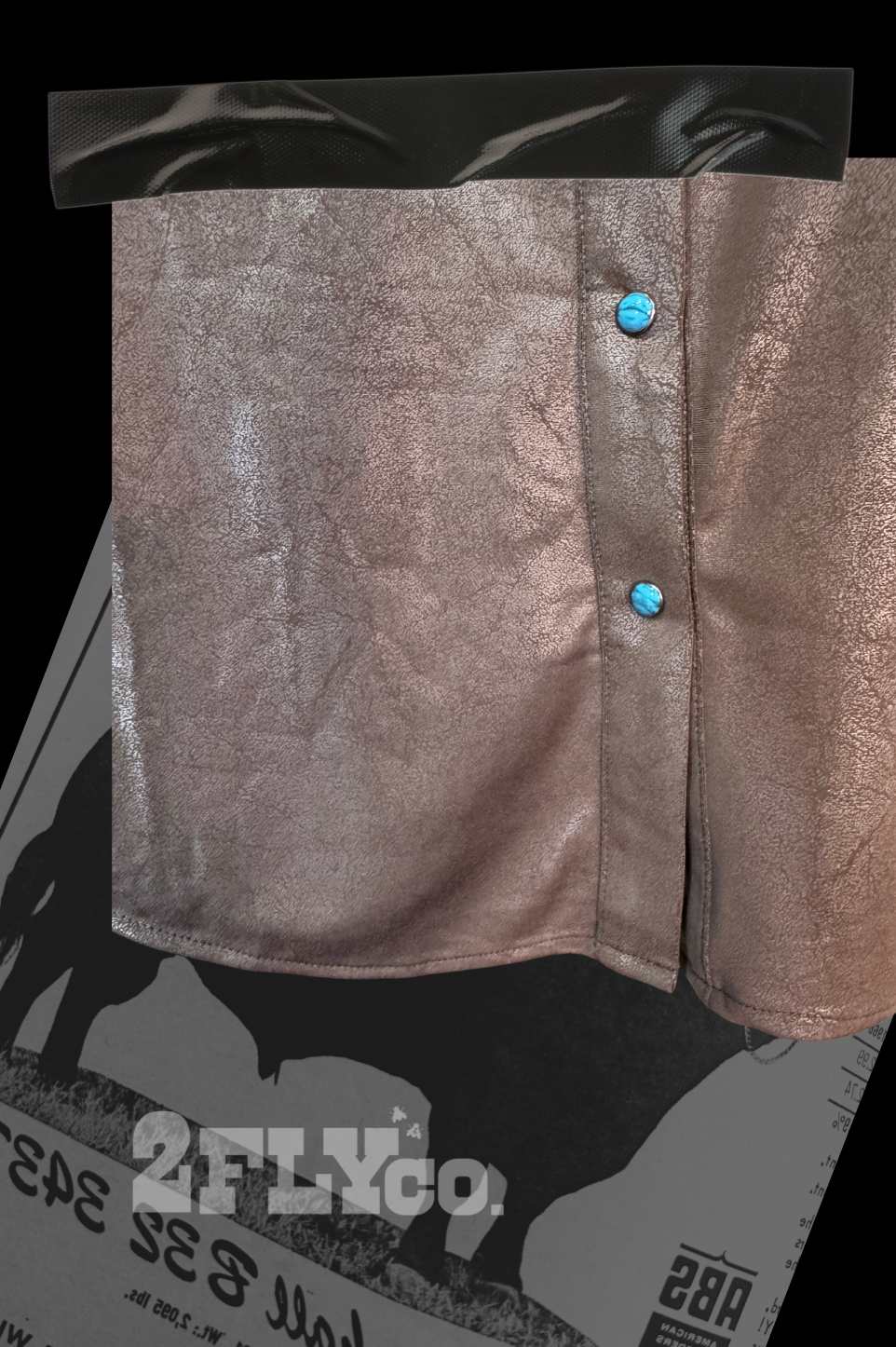 Metallic blouse with turquoise blue buttons on a black and white background