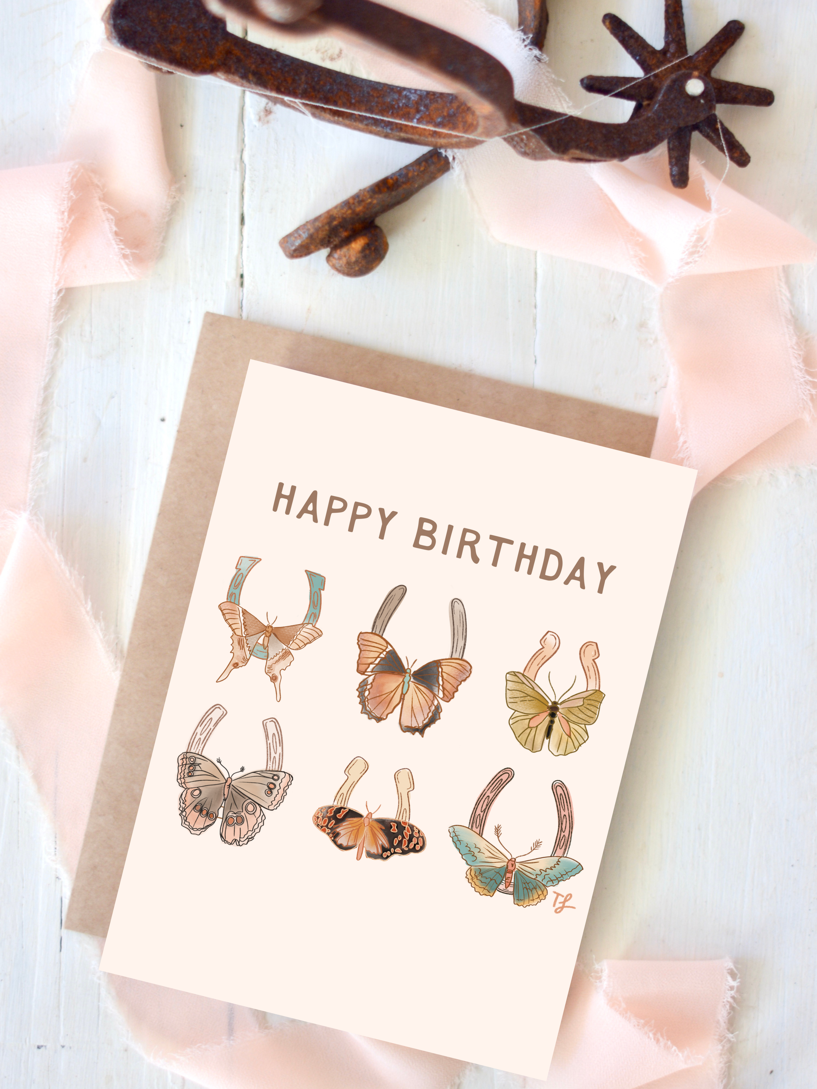 Birthday card with butterfly on horseshoes  illustrations on a white background