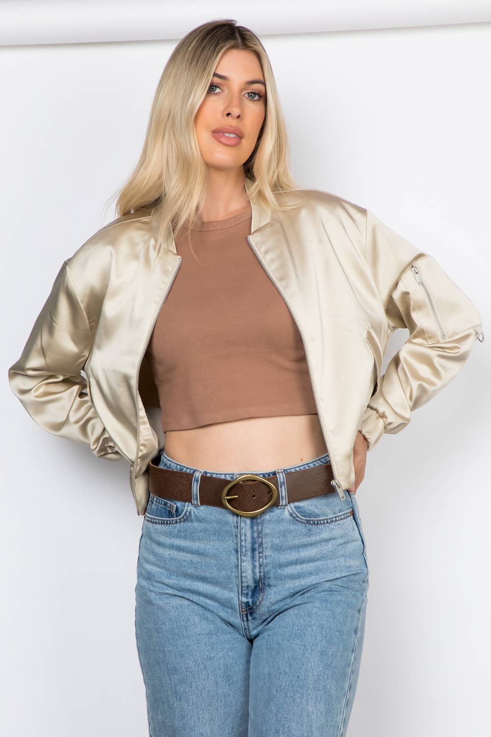 Lightweight satin bomber jacket featuring a relaxed fit, full front zipper, elastic cuffs, fully lined construction, utility sleeve pocket, and side pockets for polished everyday layering.