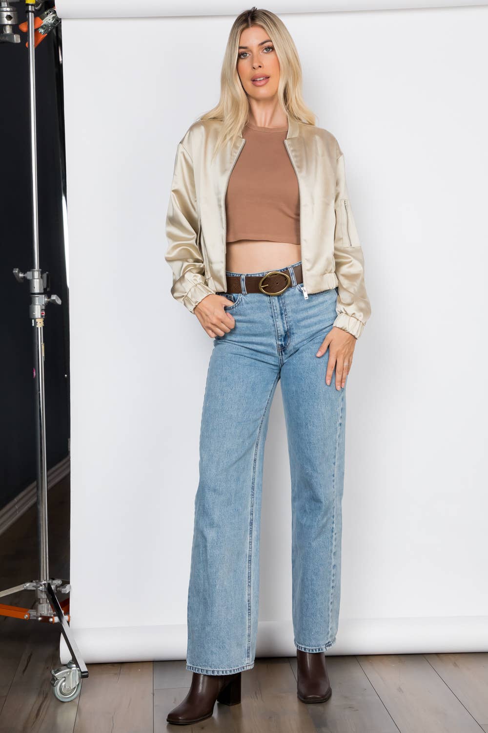Lightweight satin bomber jacket featuring a relaxed fit, full front zipper, elastic cuffs, fully lined construction, utility sleeve pocket, and side pockets for polished everyday layering.