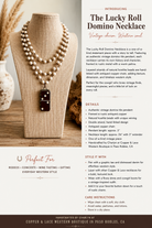An informational product graphic for the Lucky Roll Domino Necklace, featuring a close-up photo of the necklace draped on a wooden display stand. The necklace has a dark brown wooden center with a woven pattern and a silver-toned chain.