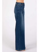 Dark denim jeans wide leg side view.