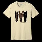 An off-white short-sleeve t-shirt with a graphic of three horse heads in black and brown silhouettes on the front, with the text 'large whiner' and 'MADE IN USA' printed below.
