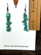 Handcrafted turquoise chip dangle earrings with ruler for size reference