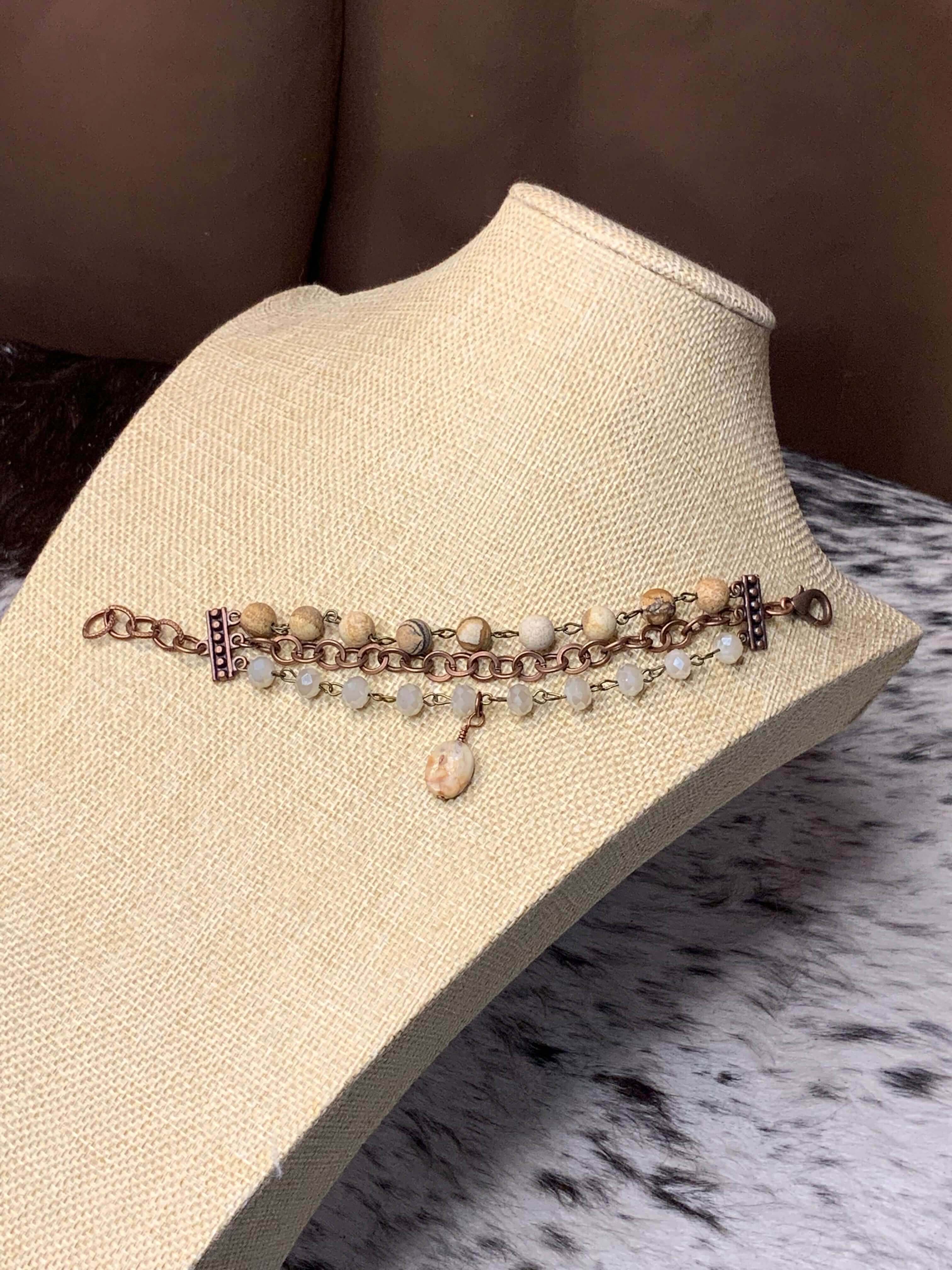 Close up of copper, Ivory Crystals, and Agate Stone Bracelet 