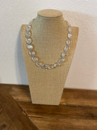 Clear crystal necklace with very simple silver spacers. 