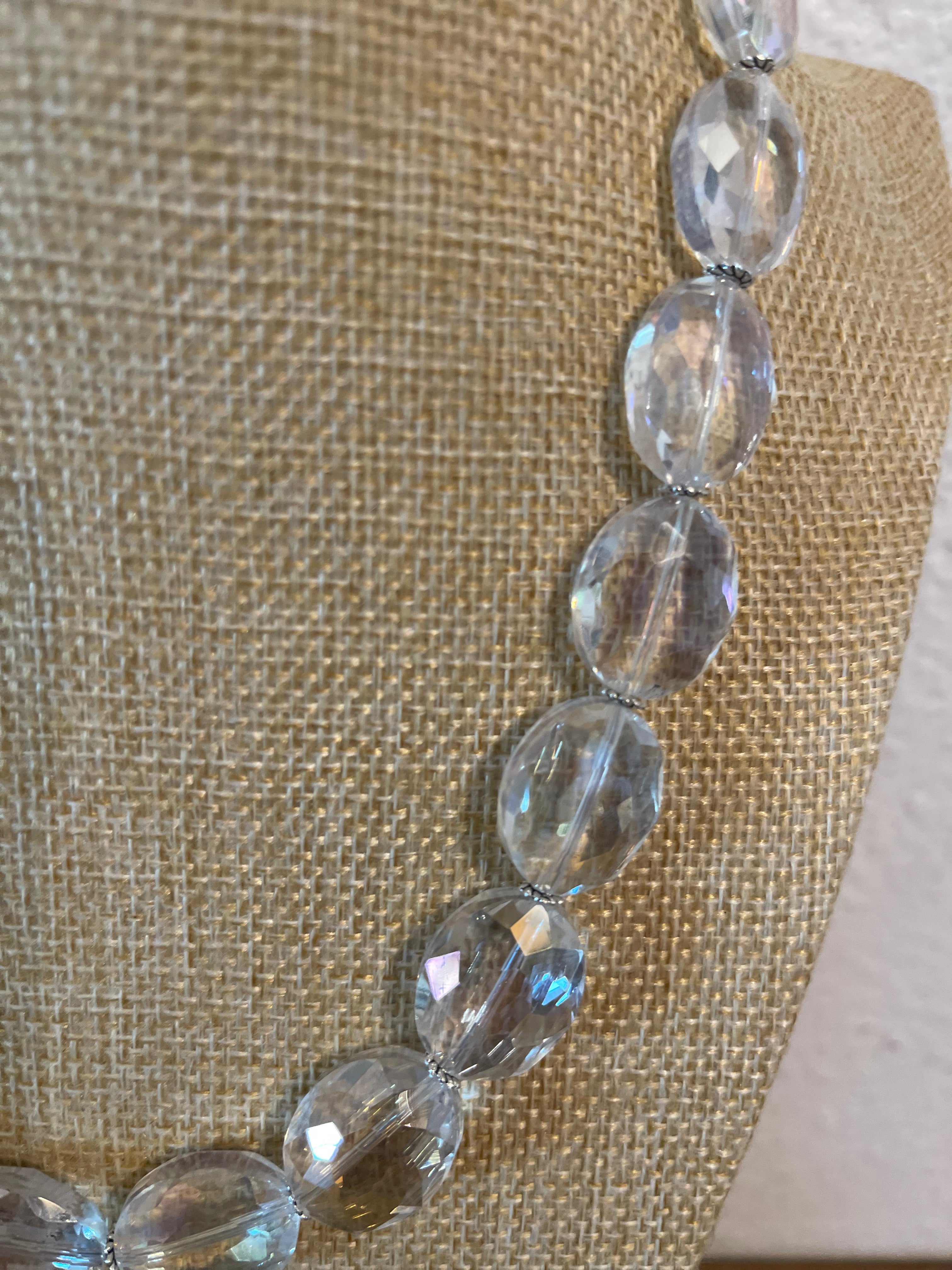 Clear crystal necklace with very simple silver spacers. 