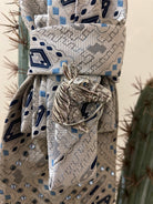 Handcrafted vintage tie necklace by Copper &amp; Lace Western Boutique featuring an authentic 1970s silver, navy, and blue patterned necktie with rhinestone embellishments, vintage silver horse head brooch, and ornate silver chain.