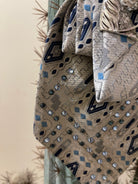 Handcrafted vintage tie necklace by Copper &amp; Lace Western Boutique featuring an authentic 1970s silver, navy, and blue patterned necktie with rhinestone embellishments, vintage silver horse head brooch, and ornate silver chain.