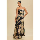 Woman wearing a strapless floral gown against a beige backgroundMagnolia Strapless Vintage Floral Maxi Dress – Black/Tan/Gold with Blue-Green Accents | Lined