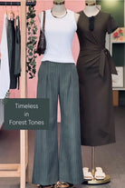 Mannequins wearing a white top, green wide leg pants, and a brown dress with text 'Timeless in Forest Tones'.