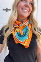 Woman wearing a colorful scarf with a white background