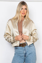 Lightweight satin bomber jacket featuring a relaxed fit, full front zipper, elastic cuffs, fully lined construction, utility sleeve pocket, and side pockets for polished everyday layering.