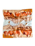 Silk scarf with a desert landscape and bison design on a white background