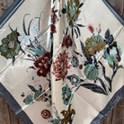 Floral patterned fabric on a wooden surface