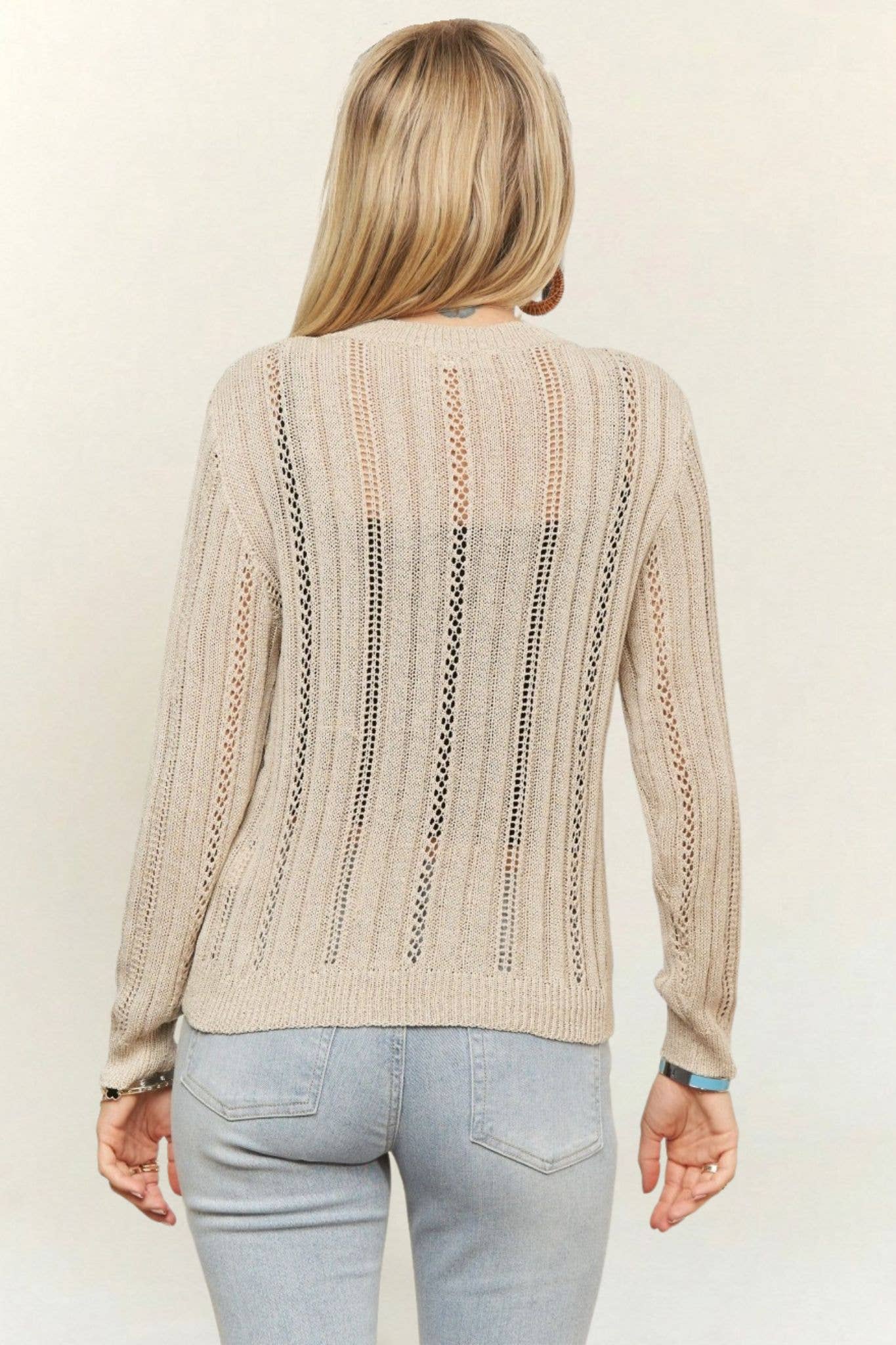 Lightweight cream open-knit cardigan featuring a button-front closure, crew neckline, vertical ribbed crochet detailing, and long sleeves for effortless layering.
