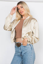 Lightweight satin bomber jacket featuring a relaxed fit, full front zipper, elastic cuffs, fully lined construction, utility sleeve pocket, and side pockets for polished everyday layering.