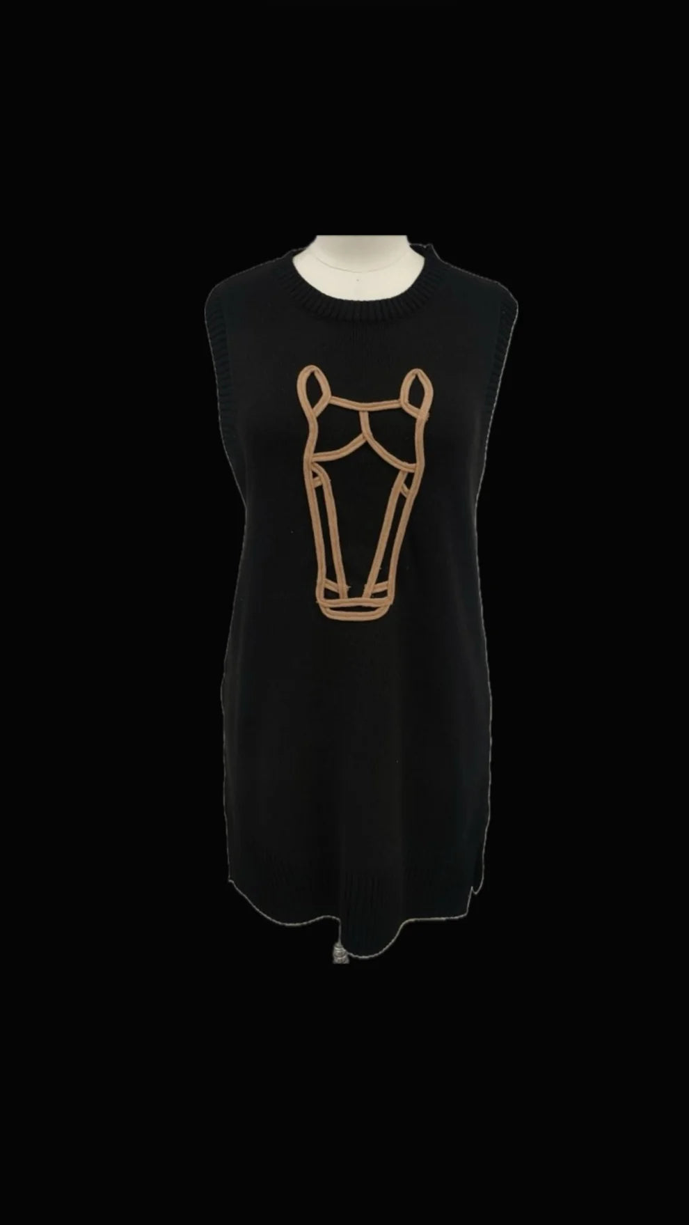 Black sleeveless dress with a beige graphic on a mannequin against a black background